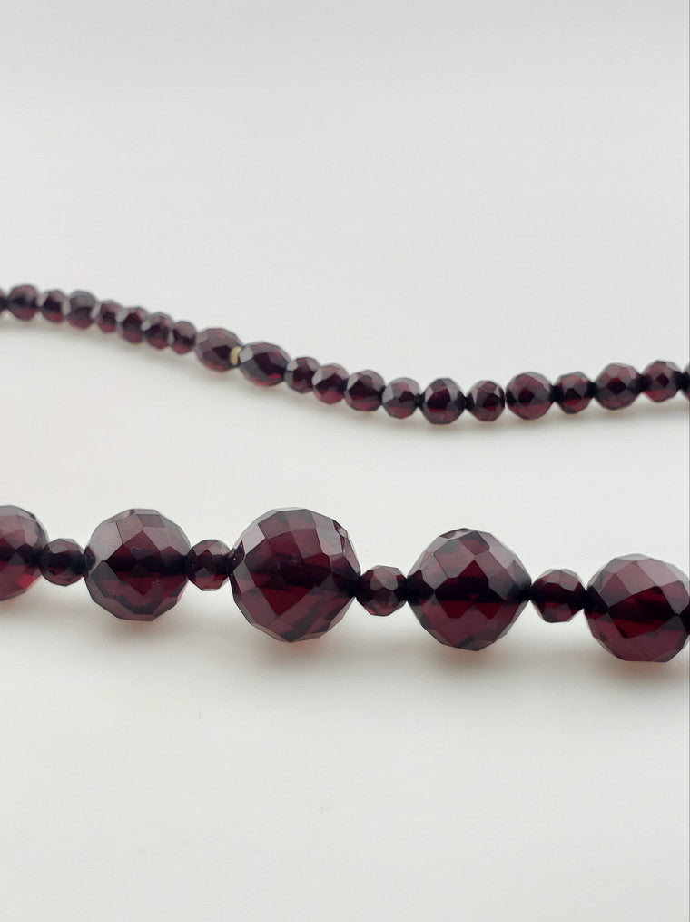 Antique Faceted "Cherry" Amber Strand